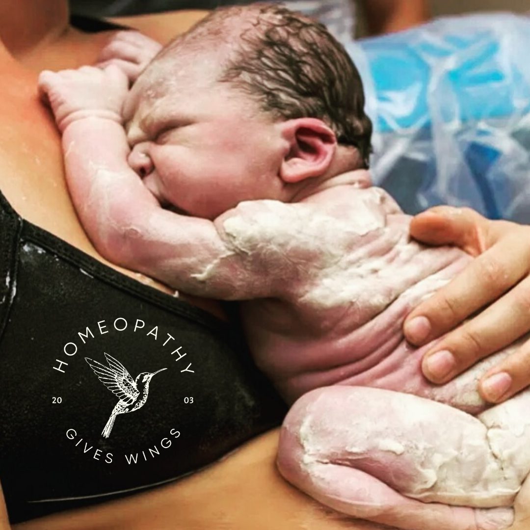 newborn baby with vernix still visible